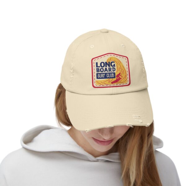 Lady wearing a face cap with a design imprinted on the front